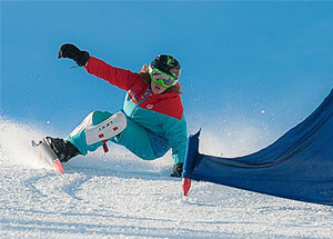 Raceboard Snowboard Actionbild